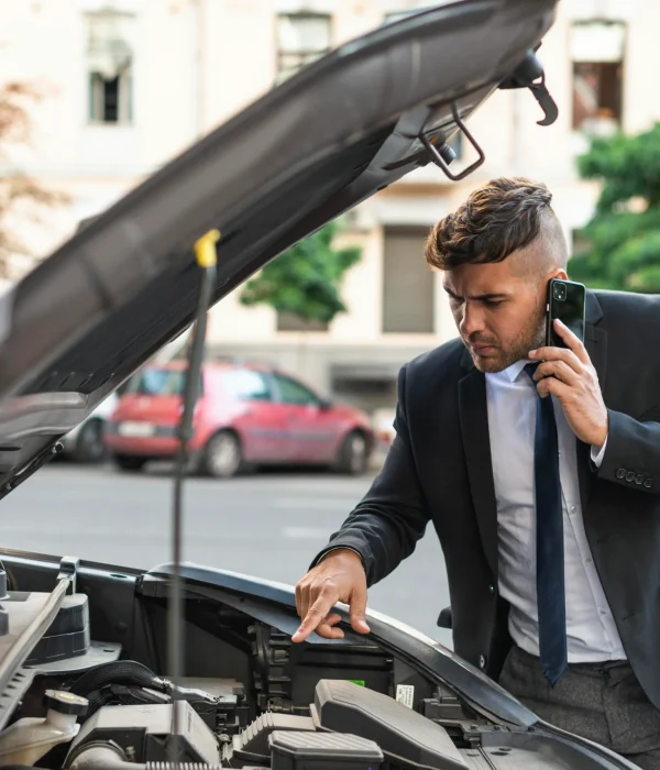 young-business-man-trying-fix-his-car